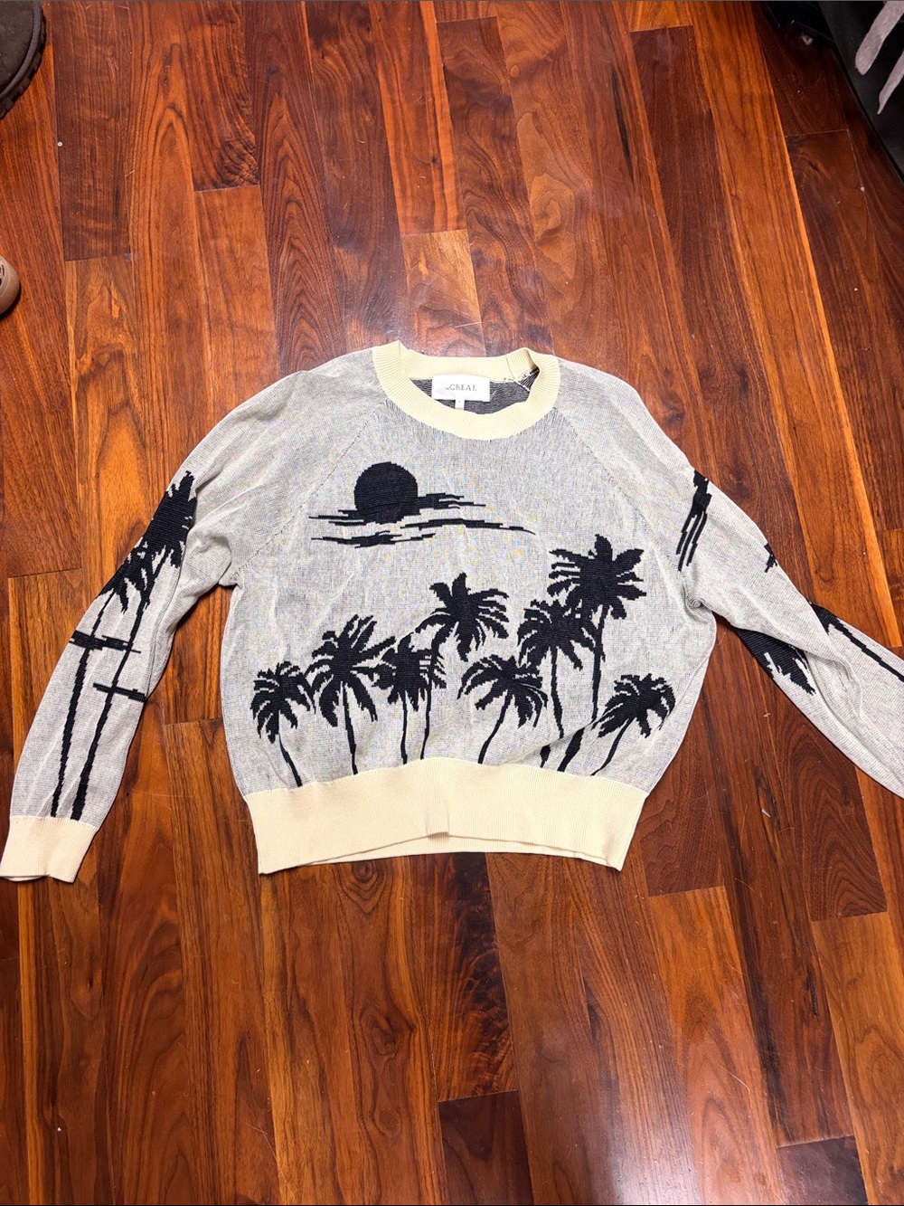 THE GREAT. Gray Sweater with Cream Trim and Black Palm Motif